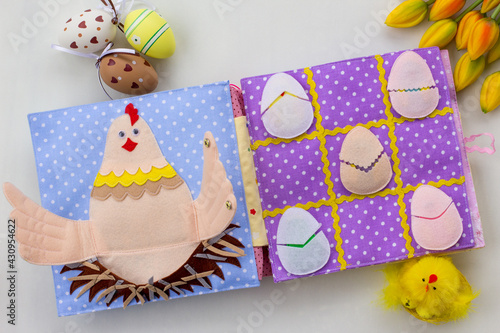 Handmade textile book for baby. Easter present for baby. Pages with felt eggs, birds and rabbits. Woolly toys on a string. Baby development. Educational toys. Fine motor skills.