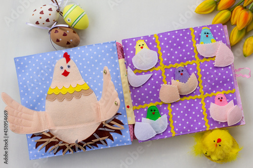 Handmade textile book for baby. Easter present for baby. Pages with felt eggs, birds and rabbits. Woolly toys on a string. Baby development. Educational toys. Fine motor skills.