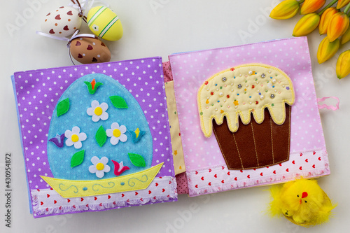 Handmade textile book for baby. Easter present for baby. Pages with felt eggs, birds and rabbits. Woolly toys on a string. Baby development. Educational toys. Fine motor skills.