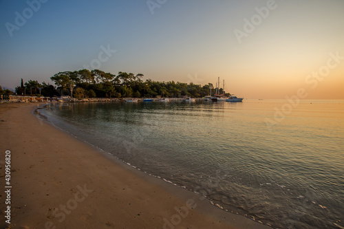 The embankment in the Turkish city of Kemer. The coastline. The Mediterranean Sea. Dawn on the sea. Seashore. Dawn on the beach.