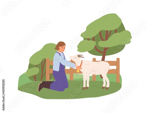 Female farmer with goat on yard. Happy woman in uniform and domestic animal o...