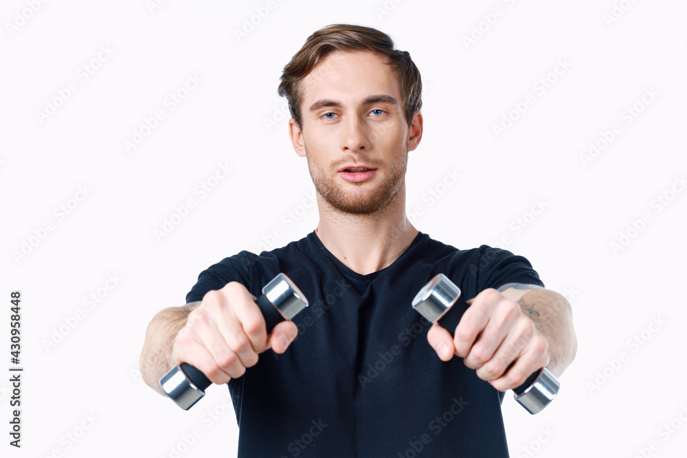 sporty young man with dumbbells on white background workout Copy Space