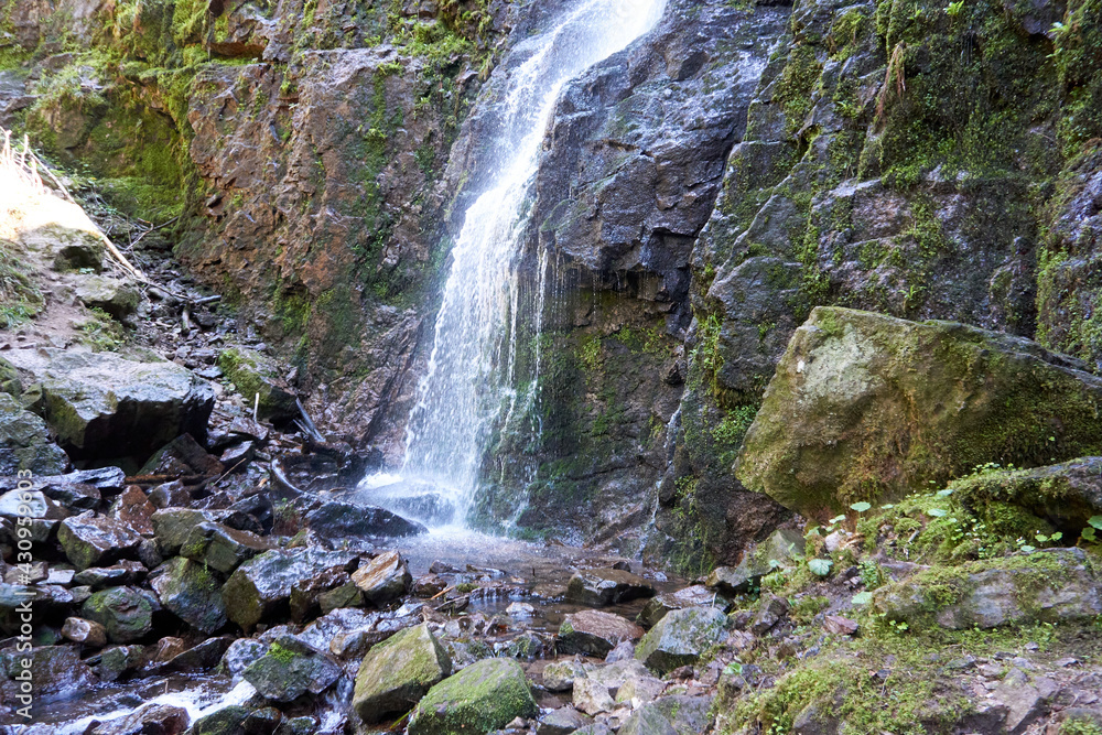 Fototapeta premium the famous and impressive Burgbach waterfall in Bad Rippoldsau in the black forest in germany