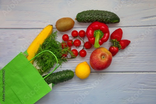 Fototapeta Naklejka Na Ścianę i Meble -  Concept photo of healthy fruits and vegetables in eco paper bag