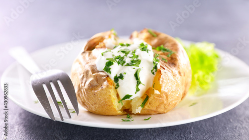 baked potato stuffed with cream and herbs