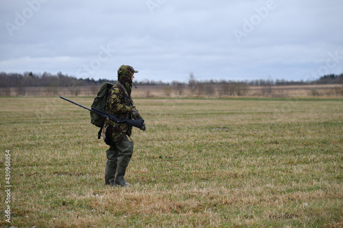 Hunter in spring field