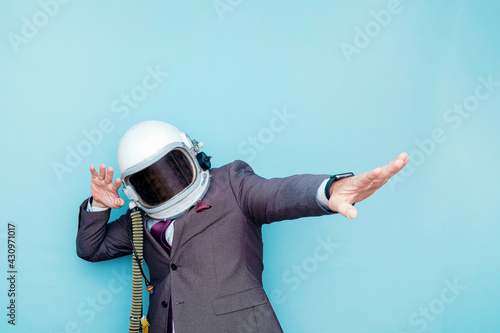 Tablou pe pânză Businessman with astronaut helmet euphoric celebrating