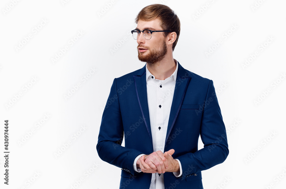man in a blue jacket and glasses light shirt gesturing with his hands man in a blue jacket and glasses light shirt gesturing with his hands