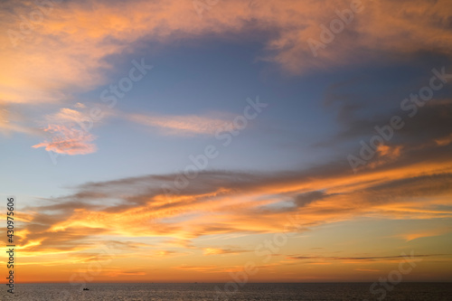 Ocean with little boat at sunset, Darwin, Northern Territory, Australia © Regis