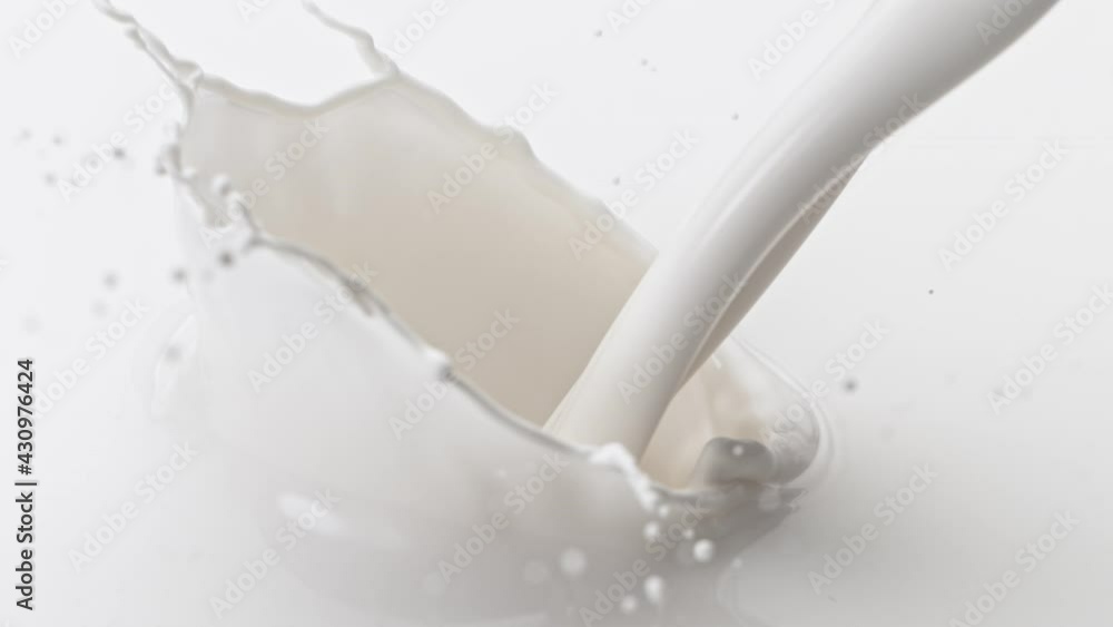 Super Slow Motion Shot of Pouring and Splashing Fresh Cream at 1000 fps. Super Slow Motion Shot of Pouring and Splashing Fresh Cream at 1000 fps.