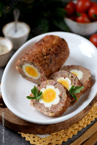 Meatloaf with boiled eggs inside. 