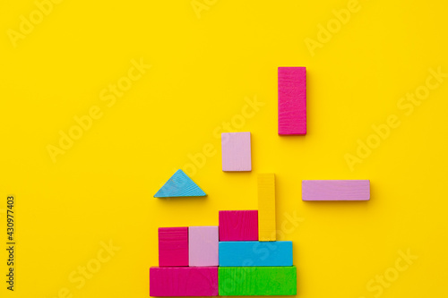 Toy kid s constructor on yellow background top view
