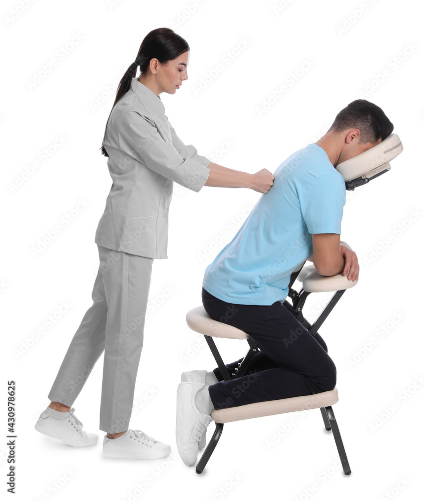 Man receiving massage in modern chair on white background Man receiving massage in modern chair on white background