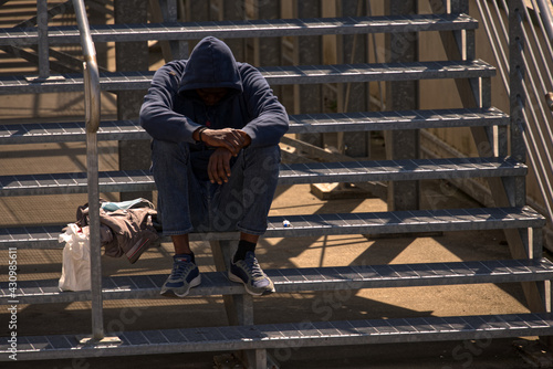 African emigrant waiting at the airport in Italy