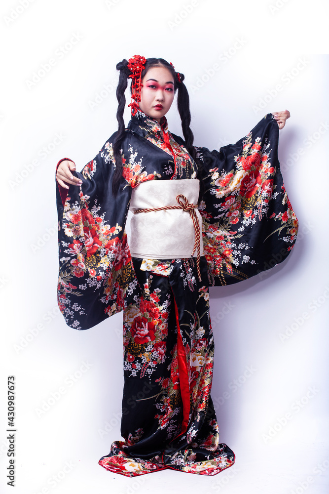 young pretty geisha in black kimono with sakura, asian ethno closeup on white background isolated young pretty geisha in black kimono with sakura, asian ethno closeup on white background isolated