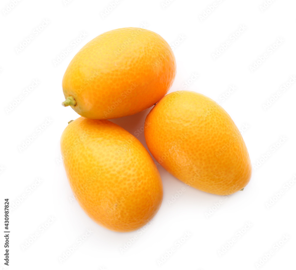 Fresh ripe kumquats on white background, top view. Exotic fruit Fresh ripe kumquats on white background, top view. Exotic fruit