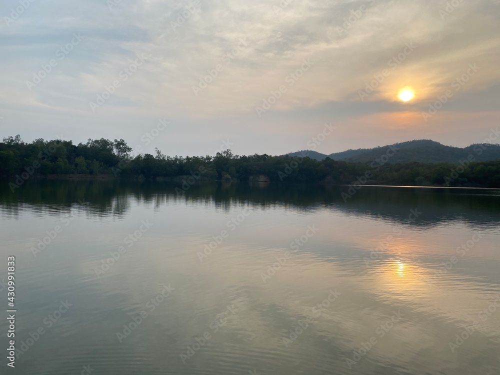 Lake view in the evening, sunset over mountain.  Concept about relax and comfort.