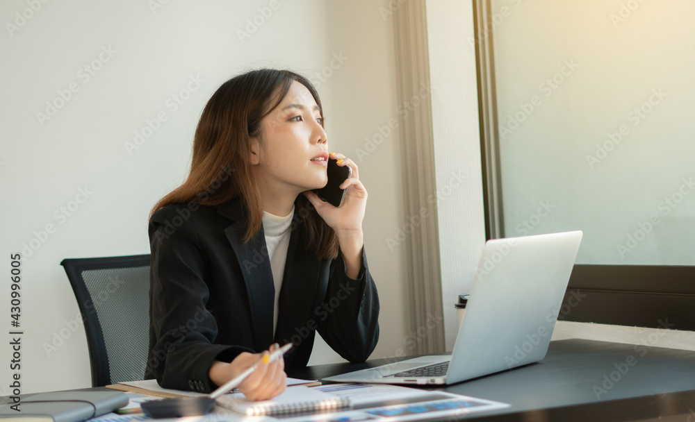 Portrait of business asian woman working in office use computer. Business owner people sme freelance online marketing ecommerce telemarketing, work from home concept Portrait of business asian woman working in office use computer. Business owner people sme freelance online marketing ecommerce telemarketing, work from home concept