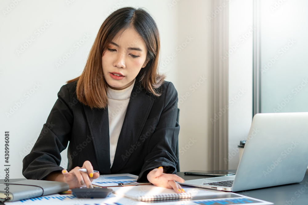 Portrait of business asian woman working in office use computer. Business owner people sme freelance online marketing ecommerce telemarketing, work from home concept Portrait of business asian woman working in office use computer. Business owner people sme freelance online marketing ecommerce telemarketing, work from home concept