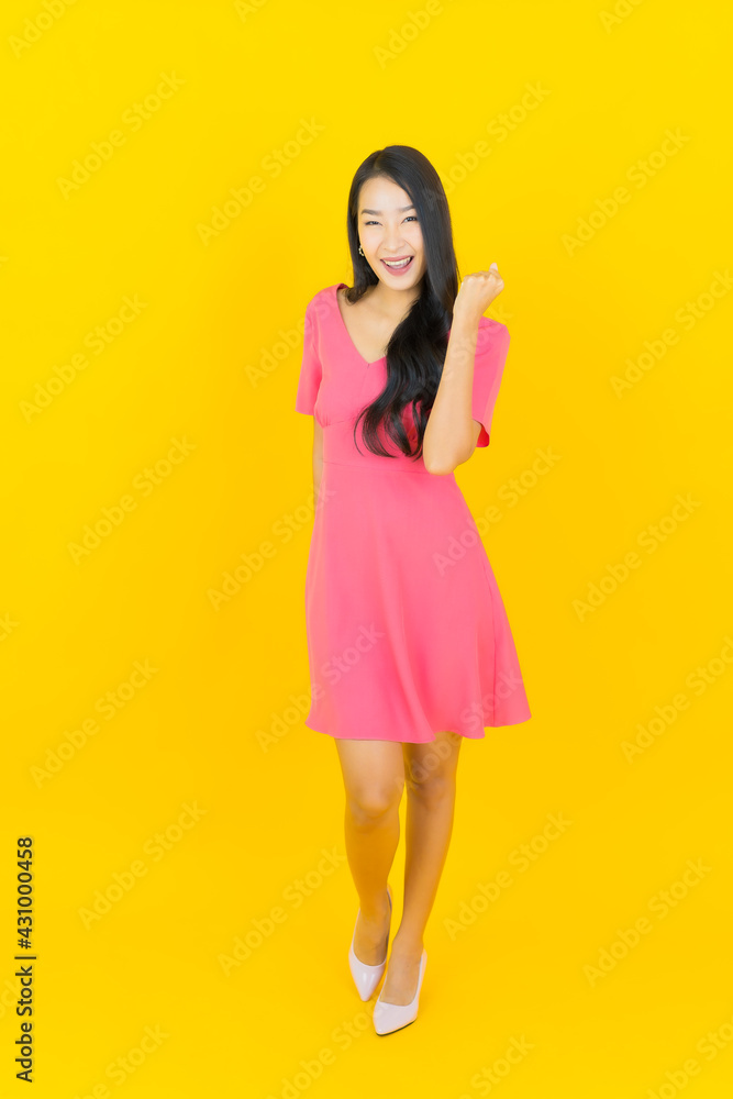 Portrait beautiful young asian woman smile with action Portrait beautiful young asian woman smile with action