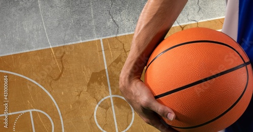 Composition of basketball player holding basketball over basketball court cracked distressed surface