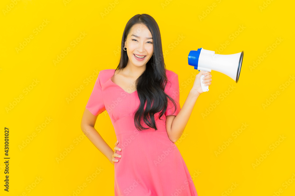 Portrait beautiful young asian woman smile with megaphone Portrait beautiful young asian woman smile with megaphone