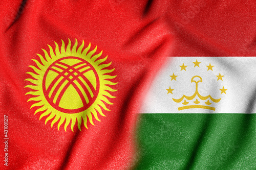 Фотография Conceptual photo with the flags of Tajikistan and Kyrgyzstan during the aggravation of relations between them
