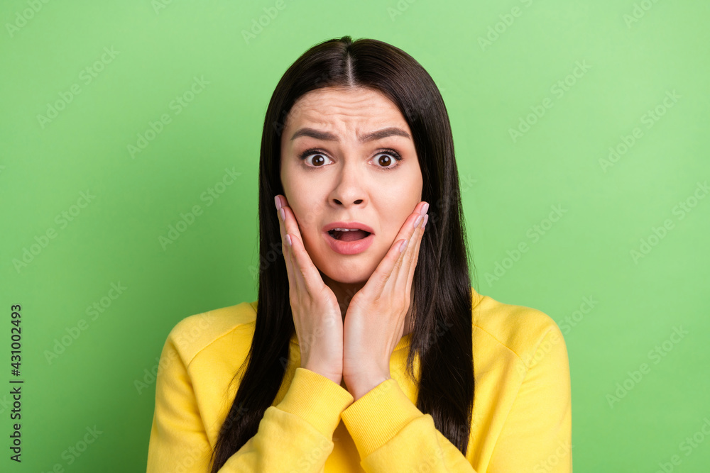 Portrait of attractive worried desperate girl bad news reaction omg isolated over green color background Portrait of attractive worried desperate girl bad news reaction omg isolated over green color background
