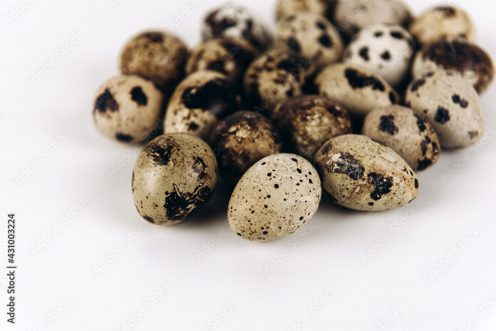 Quail eggs on the white background Quail eggs on the white background