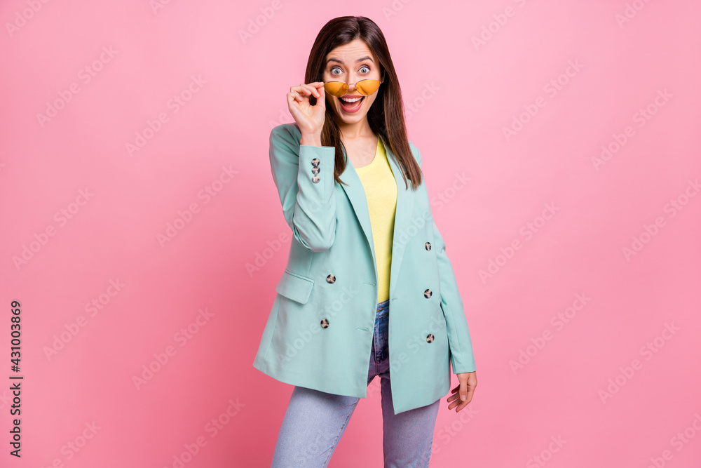 Photo portrait of amazed excited girl with open mouth taking off glasses isolated on pastel pink colored background Photo portrait of amazed excited girl with open mouth taking off glasses isolated on pastel pink colored background
