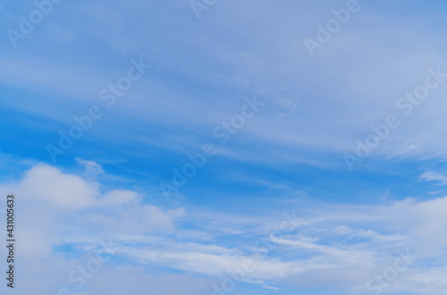 Abstract template with blue sky, white clouds and waxing half moon. Abstract natural background.