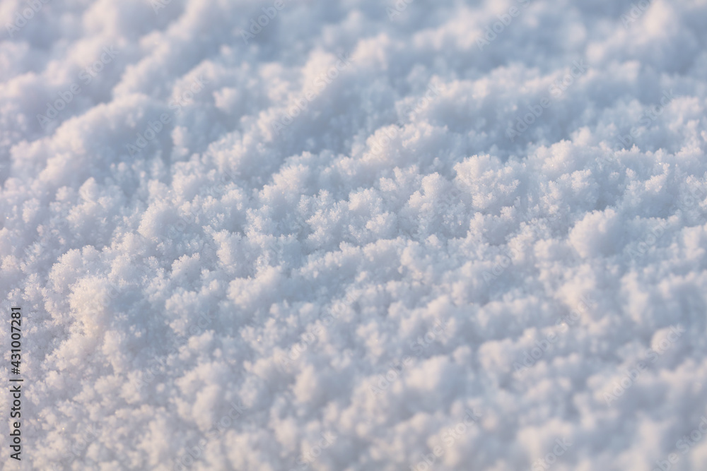 Beautiful texture of snow. Beautiful sunlight shows the texture and details of the snow