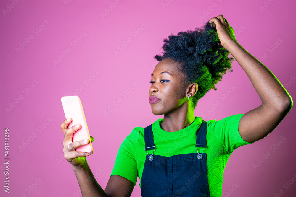 Young black woman isolated taking selfie usng smartphone