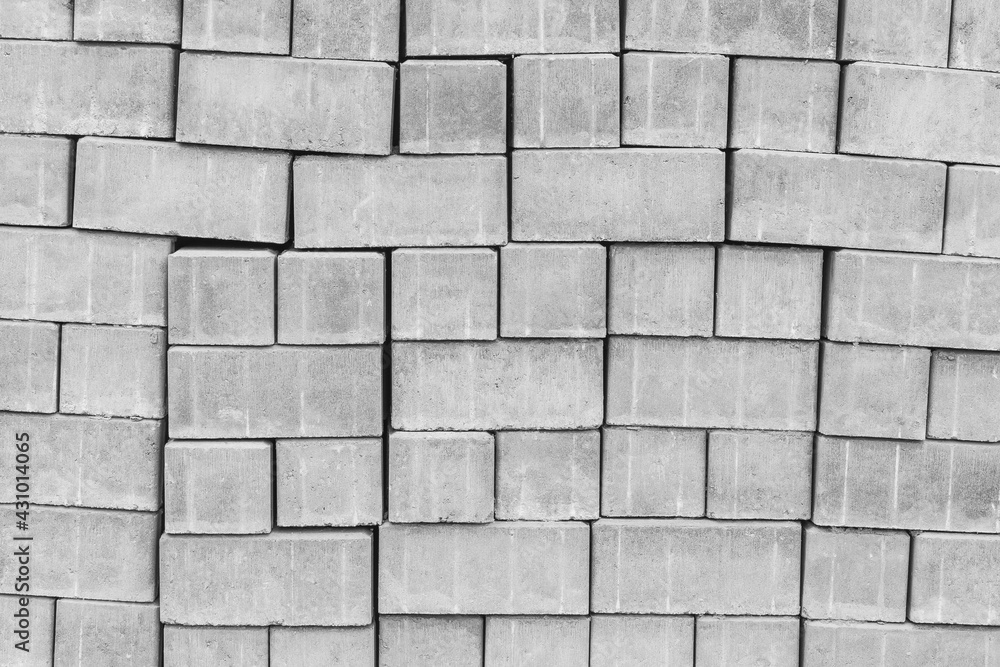 Naklejka premium A pile of new paving stone slabs texture background. Building tiled materials at the construction site