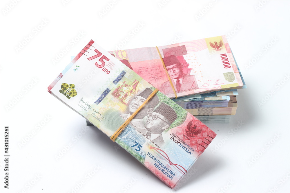 Random Layout Photo Rupiah Paper Money, 10000, 50000, 100000 and 75000 at White Background Random Layout Photo Rupiah Paper Money, 10000, 50000, 100000 and 75000 at White Background