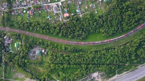 Drone view of a moving freight train in the suburbs of Vladivostok