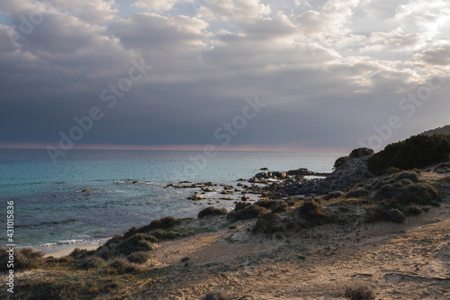 Beautiful sandy beach at evening with translucent sea in sardinia  Italy.