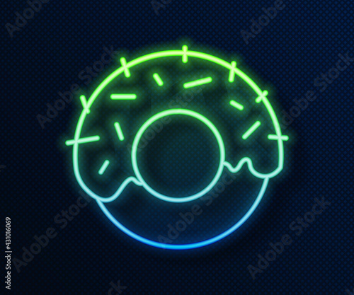 Glowing neon line Donut with sweet glaze icon isolated on blue background. Vector