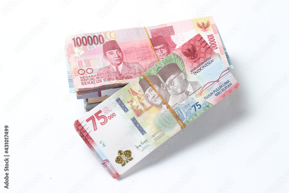 Random Layout Photo Rupiah Paper Money, 10000, 50000, 100000 and 75000 at White Background Random Layout Photo Rupiah Paper Money, 10000, 50000, 100000 and 75000 at White Background