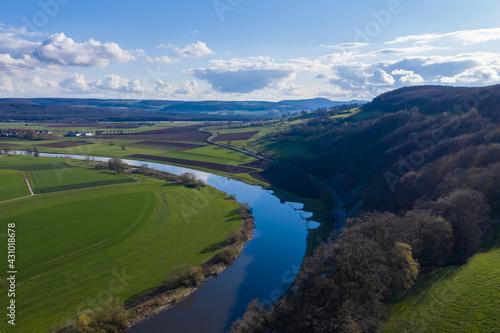 View of drone of landscape of river Weser and village Doelme in Germany .