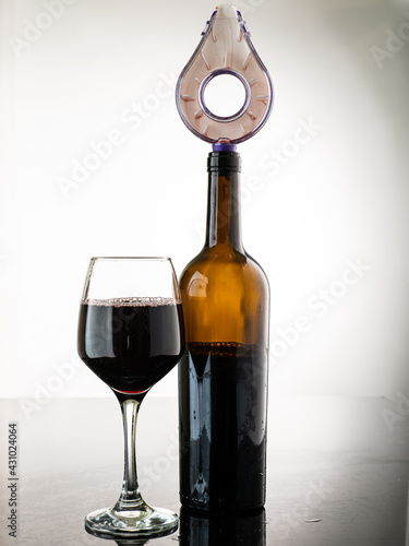 pour wine through the aerator to oxygenate the wine, stream the wine with bubbles photo