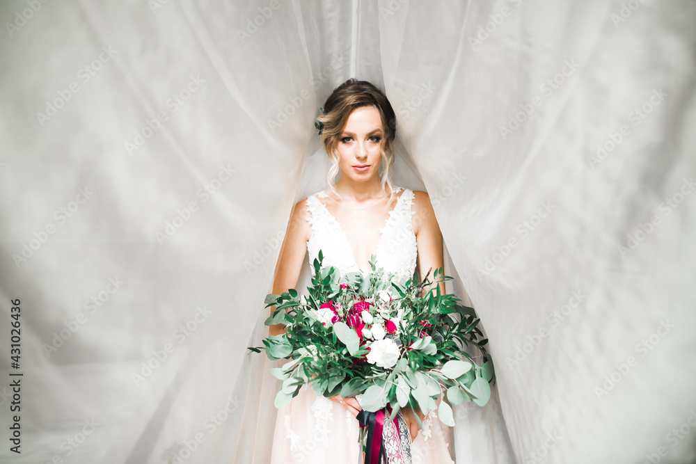Portrait of beautiful bride with fashion veil at wedding morning Portrait of beautiful bride with fashion veil at wedding morning