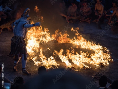 Kecak fire dance art performance show, traditional spiritual culture Ramayana ceremony at Uluwatu Temple Bali Indonesia