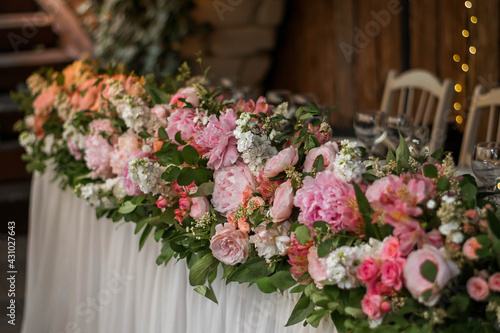 Main table at a wedding reception with beautiful flowers