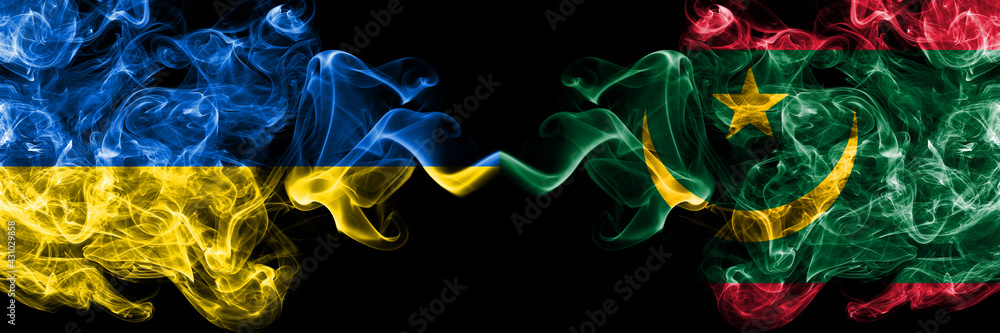 Fototapeta premium Ukraine, Ukrainian vs Mauritania smoky mystic flags placed side by side. Thick colored silky abstract smokes flags.