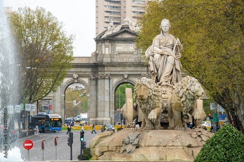 Plaza de Cibeles and statue of the goddess Cibeles overlooking the Puerta de Alcala in the city of Madrid in Spain