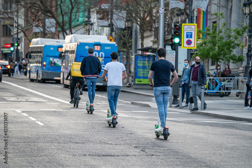 People riding bicycles and scooters on the bike lanes of Madrid in Spain during a sunny day © MARIO MONTERO ARROYO