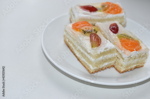 White fruit delicious cake on a white plate