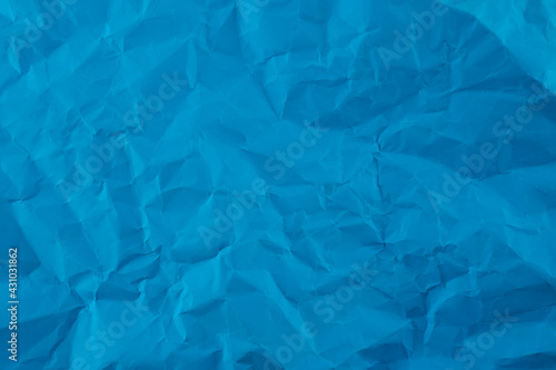 Wrinkled blue paper fragment as a background texture