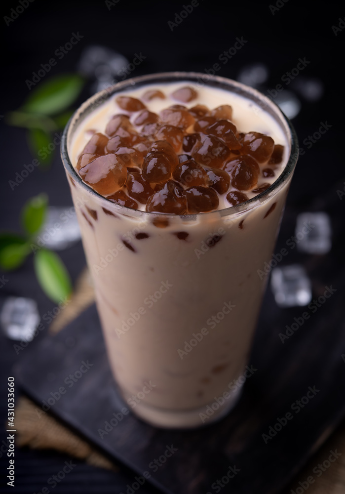 Taiwan milk tea with bubble (tapioca ball)on wood background Taiwan milk tea with bubble (tapioca ball)on wood background